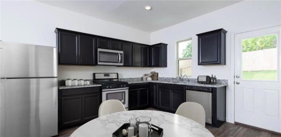 Kitchen featuring stainless steel appliances, hea