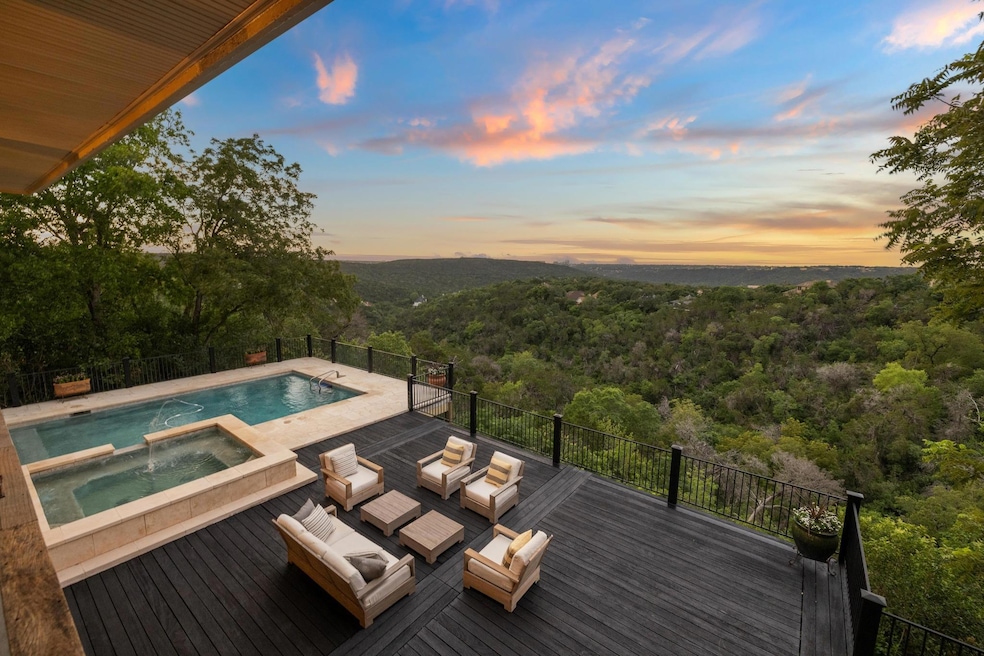 Pool at dusk with a forest view, outdoor lounge a