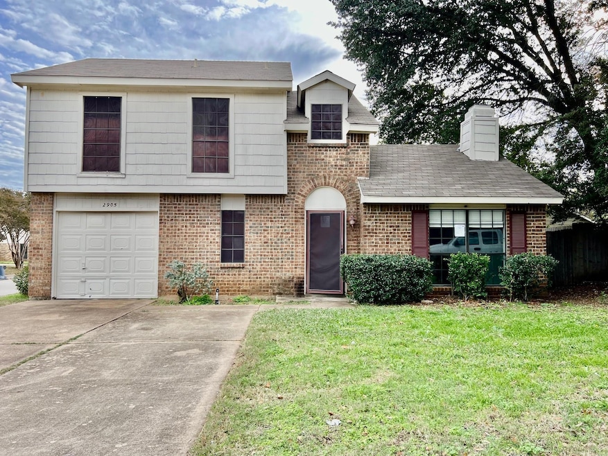 View of front of property with a front yard and a 