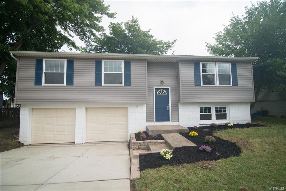 Exterior of front showing new driveway.