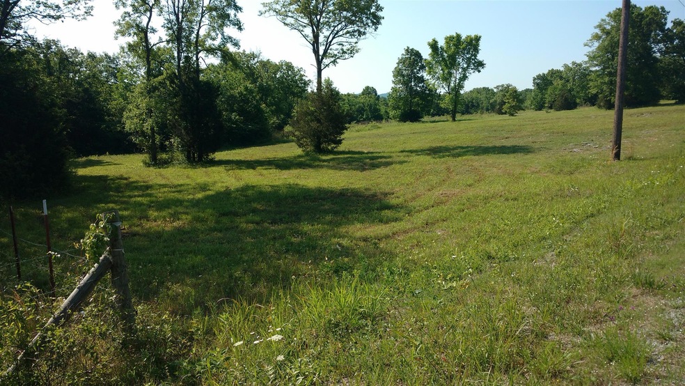 North corner of property line by fence of Horse Barn