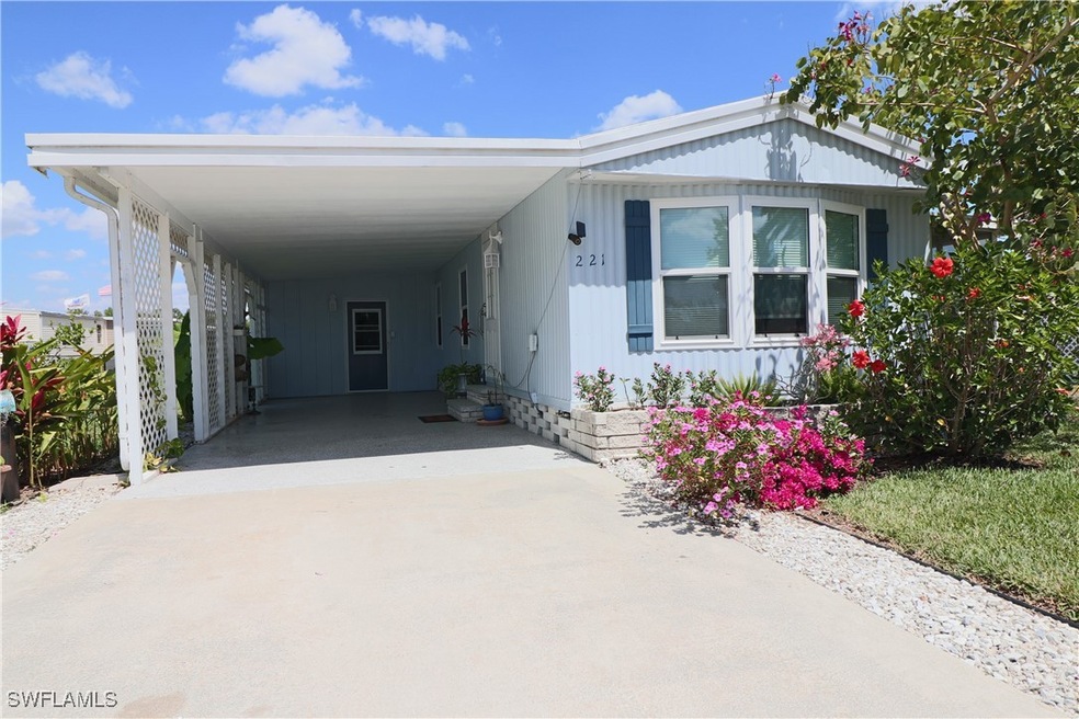 View of front of house with driveway and an attach