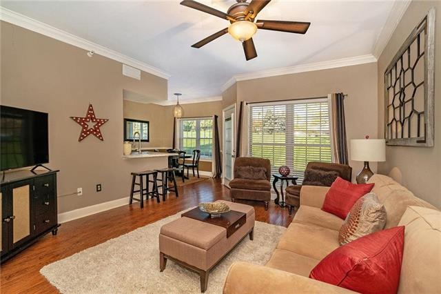 Updated family room with large window.