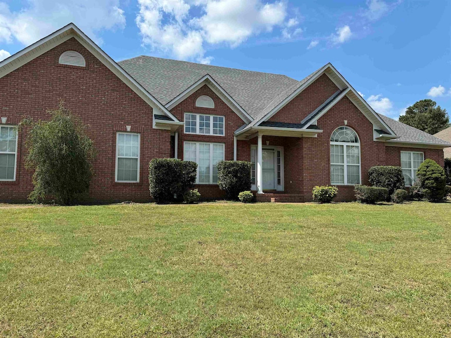 View of front of property with a front yard