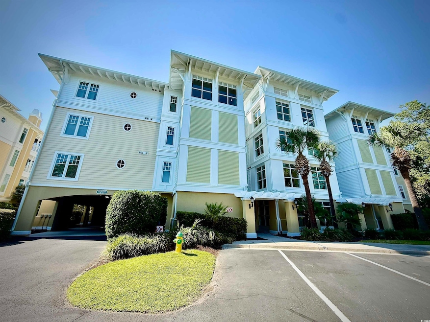 View of property with uncovered parking