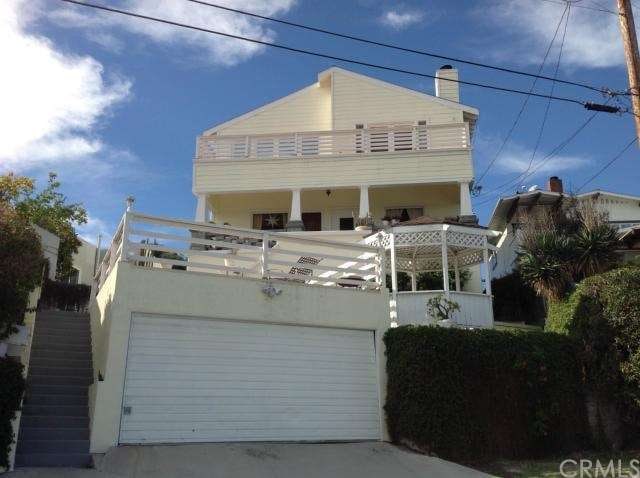 View of the front with 2 car garage, patio deck an