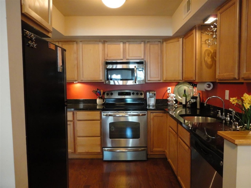 Kitchen has hardwood floors, granite counter tops,
