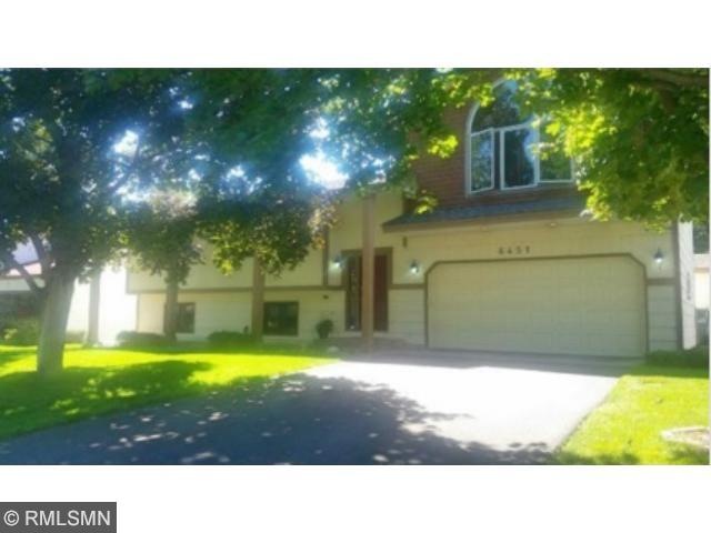 Welcome to 6451 Lancaster Lane N in Maple Grove. T