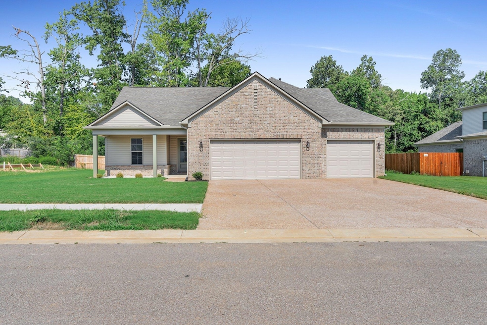 View of front of home featuring a garage and a fro