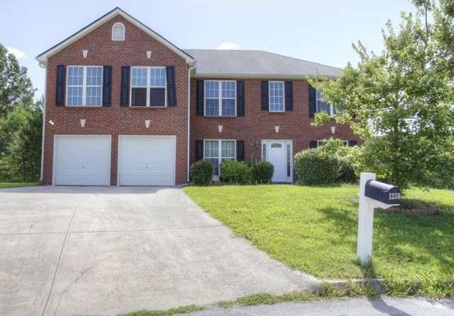 1234 Oak Knoll Court: Two car garage, brick front,