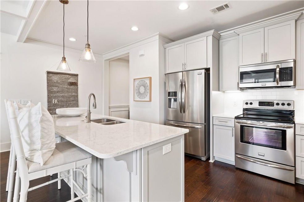 Enjoy the subtle calm of the light gray cabinetry