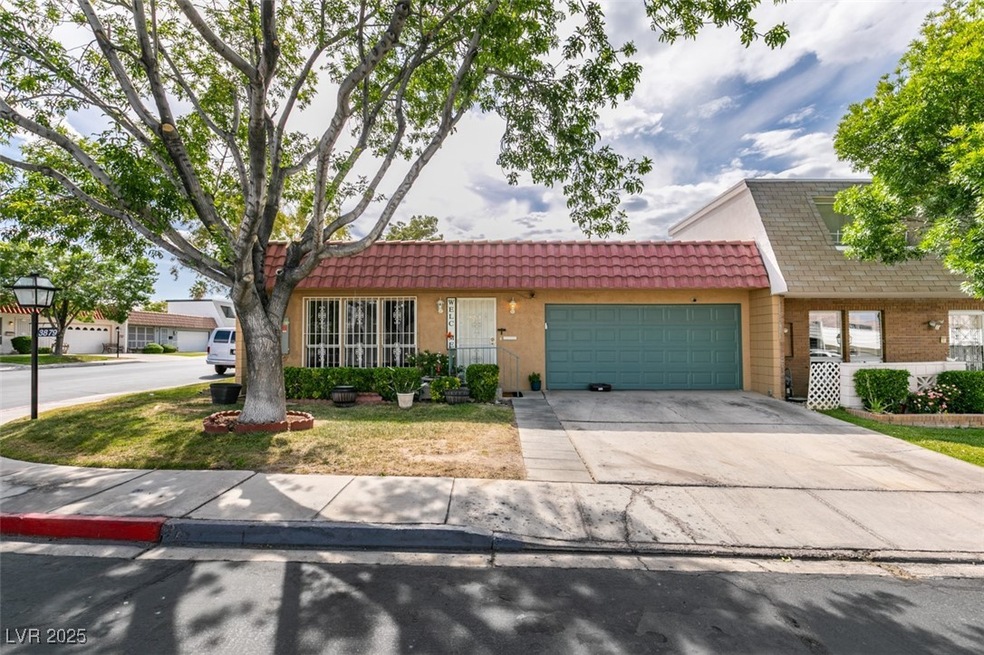 View of front of property with concrete driveway,
