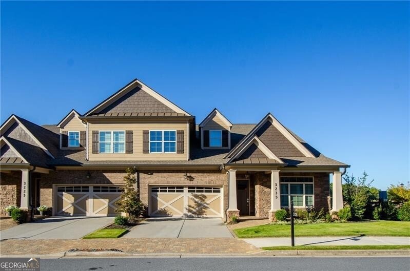 Craftsman Style Home with garage and front yard