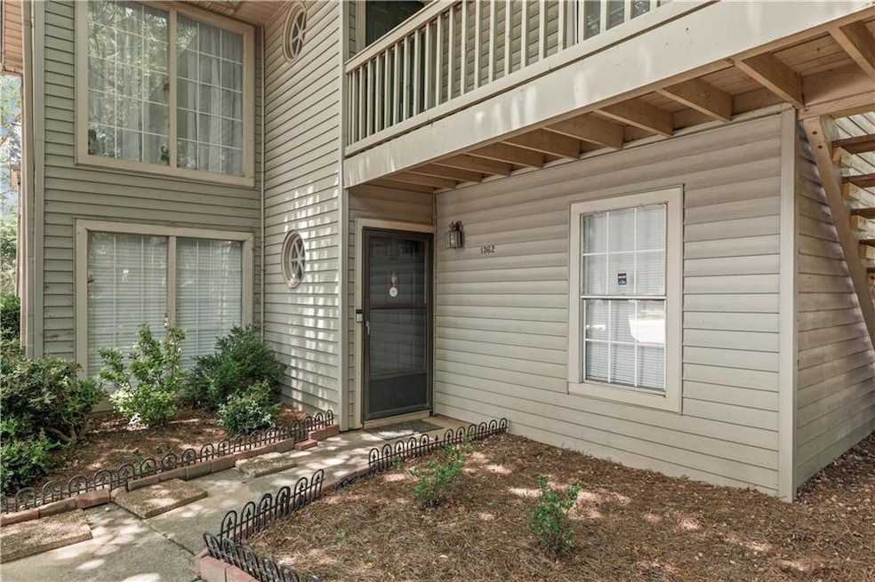 View of exterior entry with a balcony