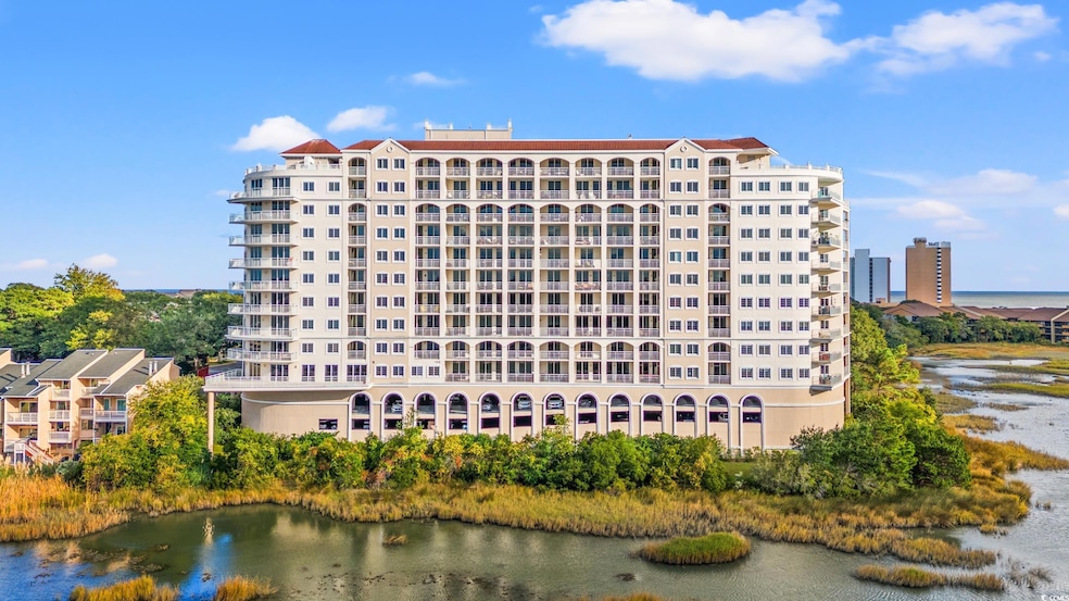 View of building exterior featuring a water view