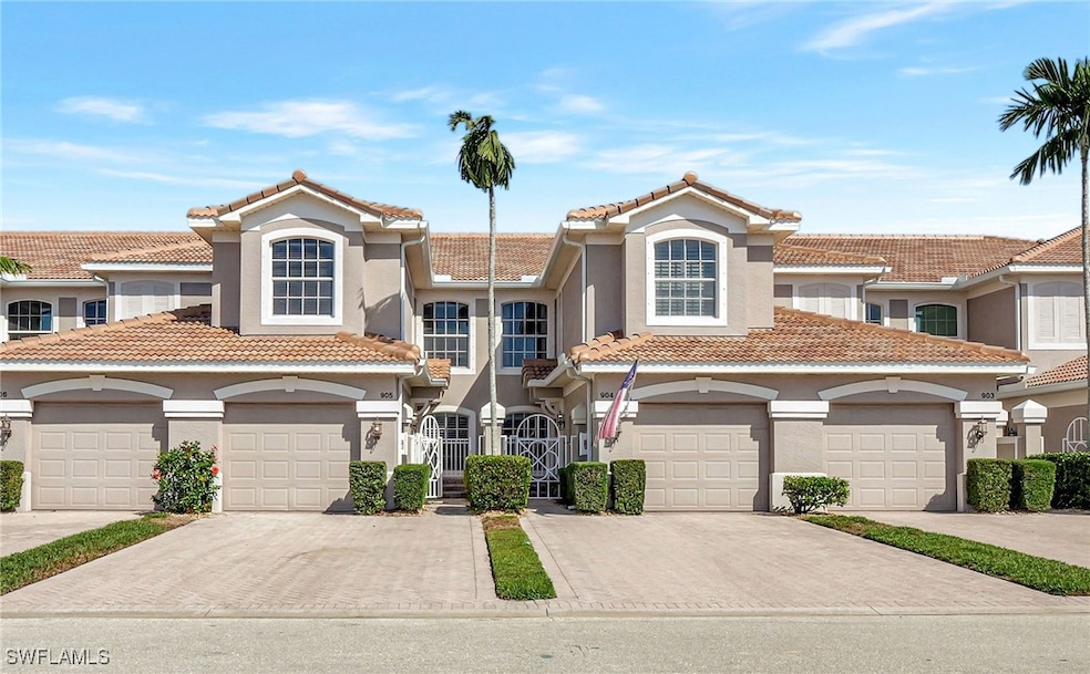 View of the coach home, featuring gated entrance,