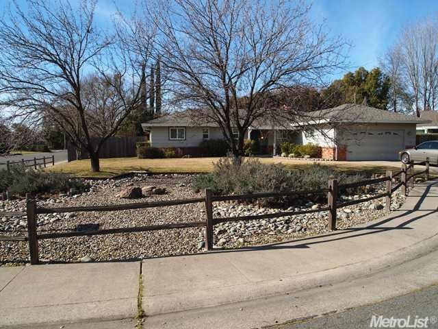 Large, beautifully landscaped front yard on the co