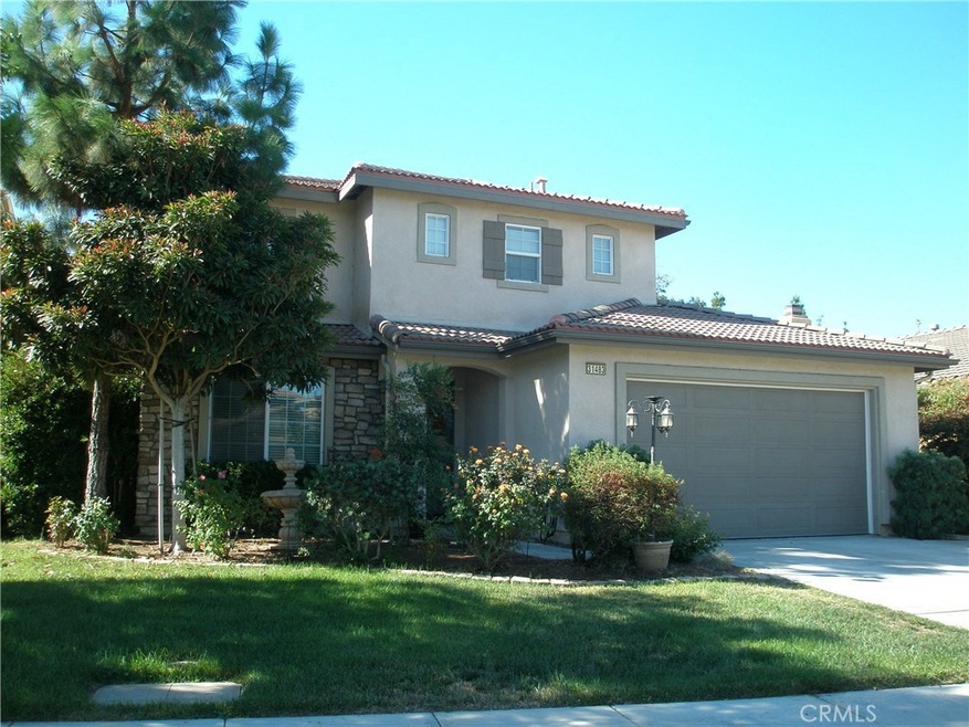 Beautiful home built by Ryland in 2005 with a 3-car tandem garage!