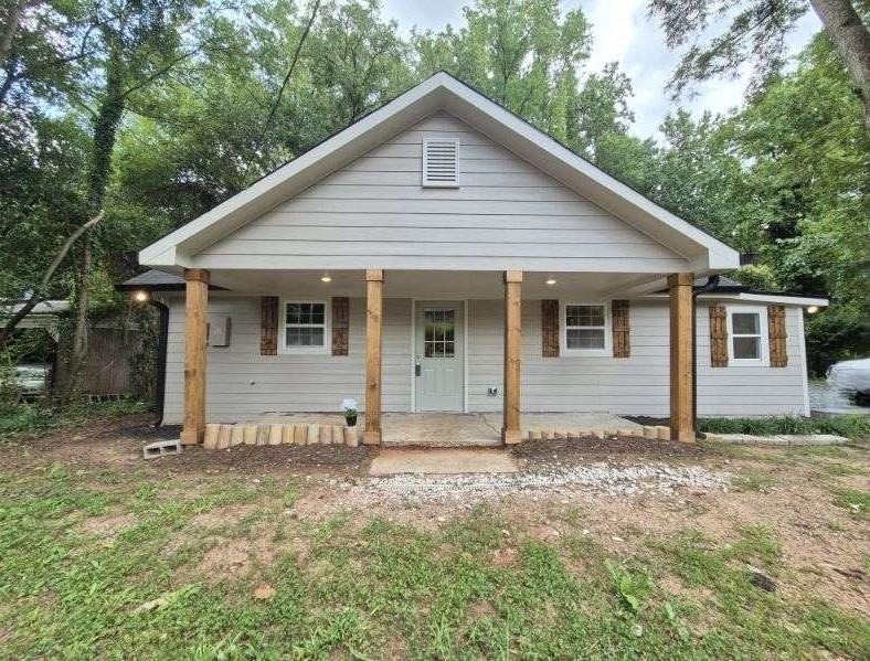 Bungalow featuring a porch