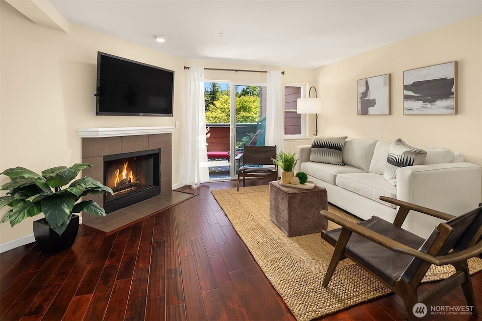 This light-filled 644 square foot 1 bedroom, 1 bath unit with wood-burning fireplace at Regentwood  is warm and cozy in winter, charming in spring and summer with a spacious deck and view of trees.