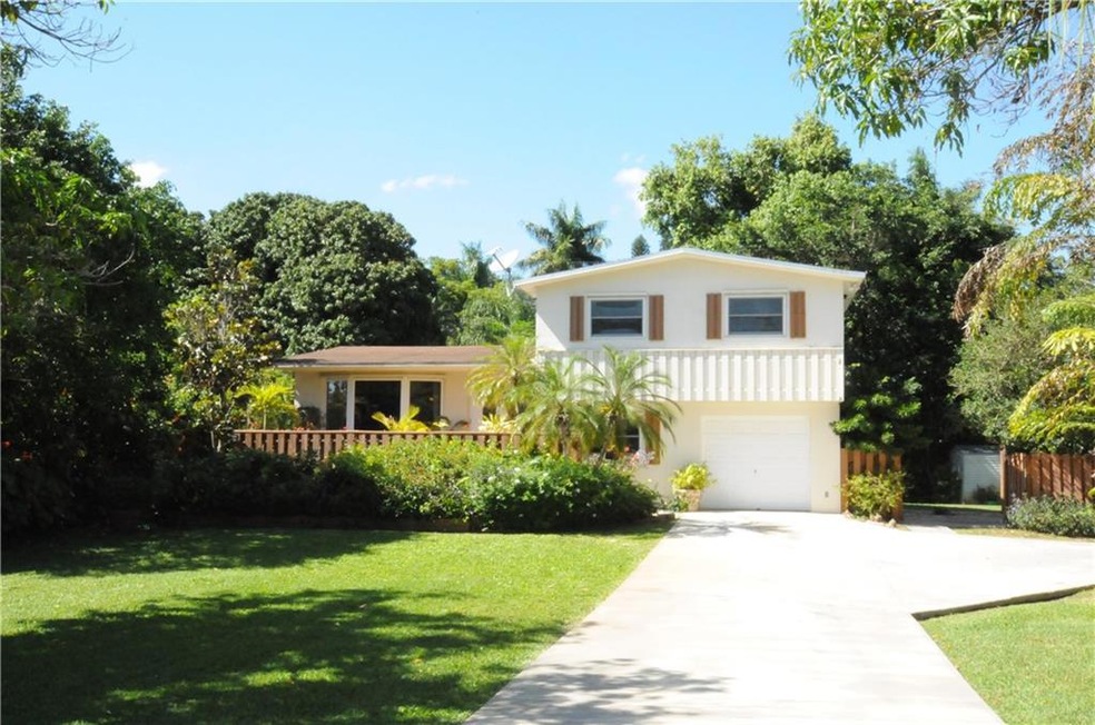 Landscaped with mature trees surround property for