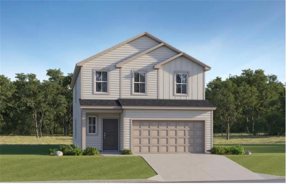 View of front of property with a front lawn, board and batten siding, concrete driveway, and a garage