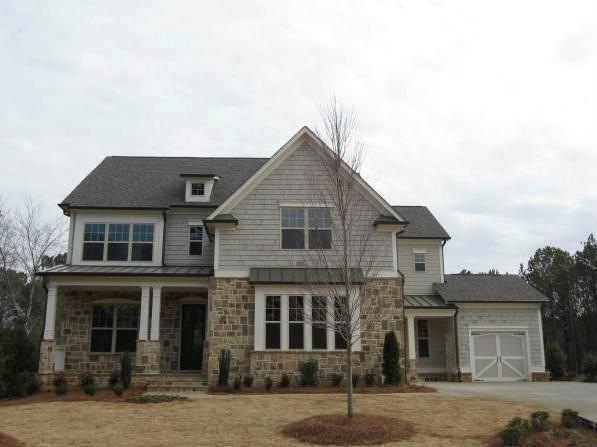 Exterior Front. Executive Home Exterior with Natur