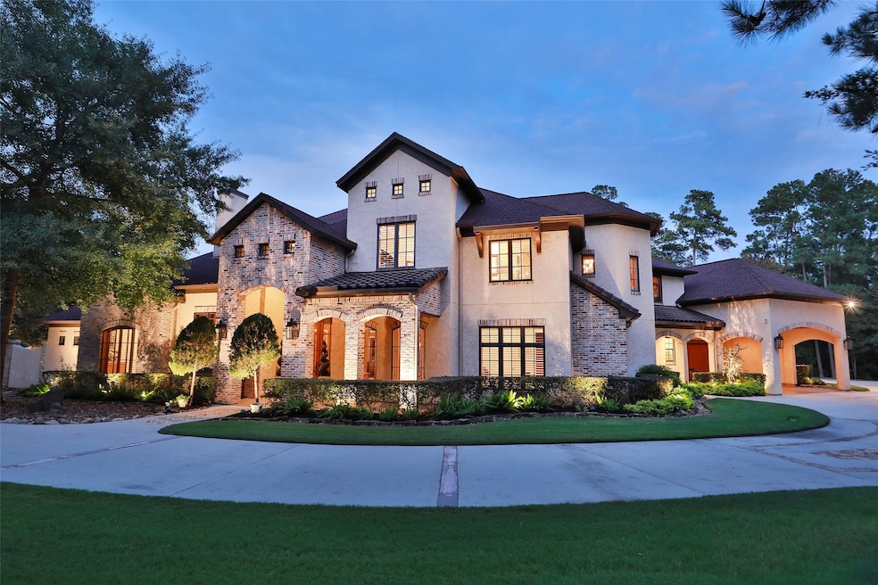 Presenting 28222 Meadow Falls with a view of the Front Exterior W/ Beautiful Landscape Lighting throughout the property