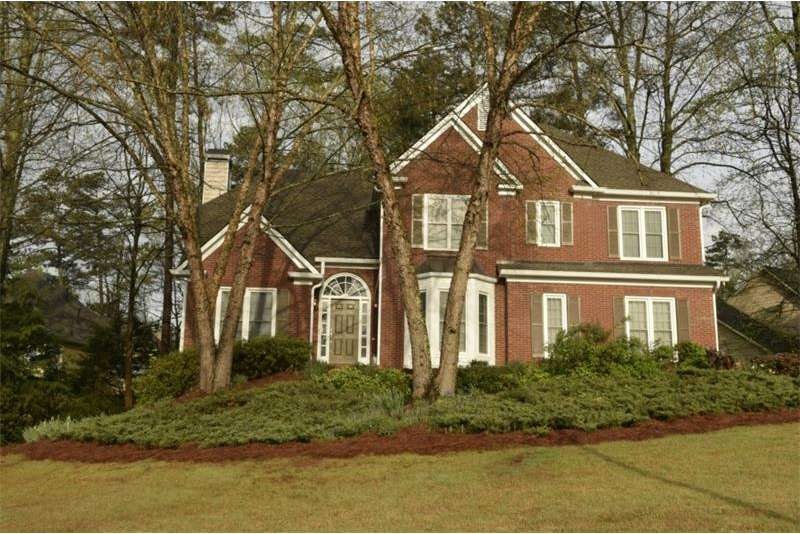 Front elevation showing professional landscaping a