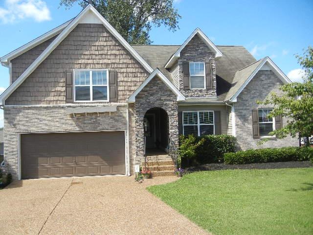 Beautiful brick and stone masonry set this home ap