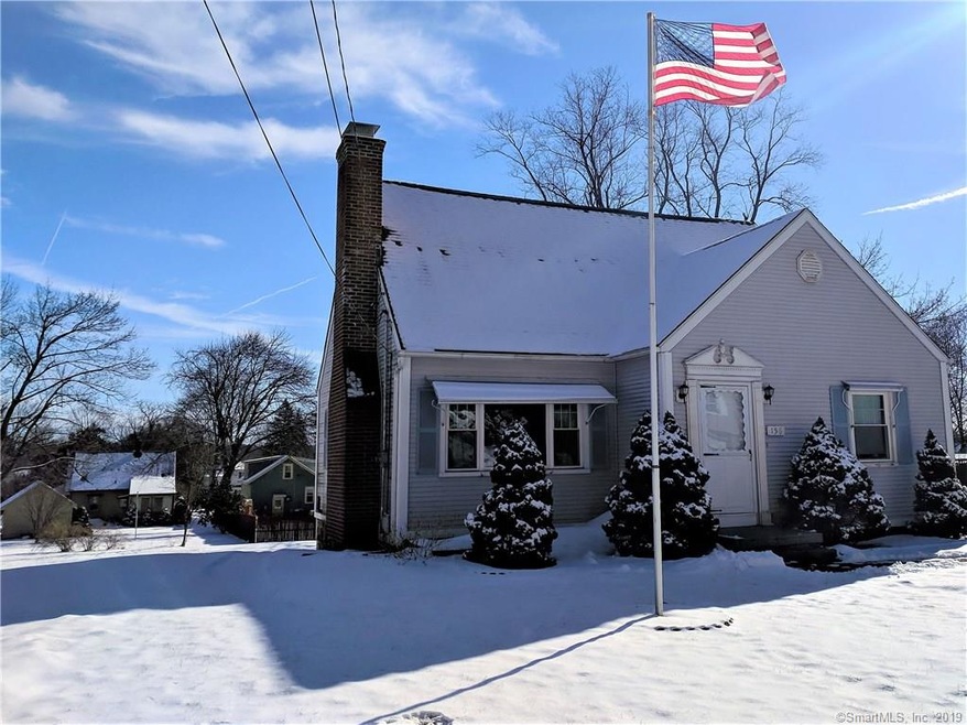 View of the Side Yard and Flagpole. Notice the Awn