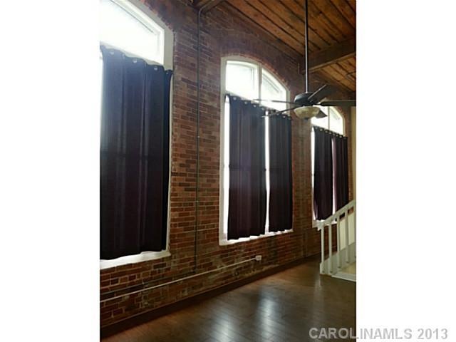 Living Room - 17 foot ceilings with 12 foot arched