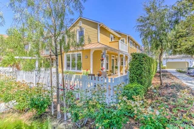 Home Sweet Home!  White picket fence surrounds thi