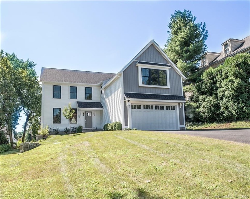 Exterior is accented with white and gray vinyl sid