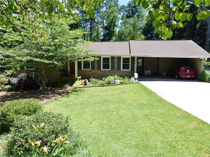 Charming 4 sides brick ranch with all new windows!
