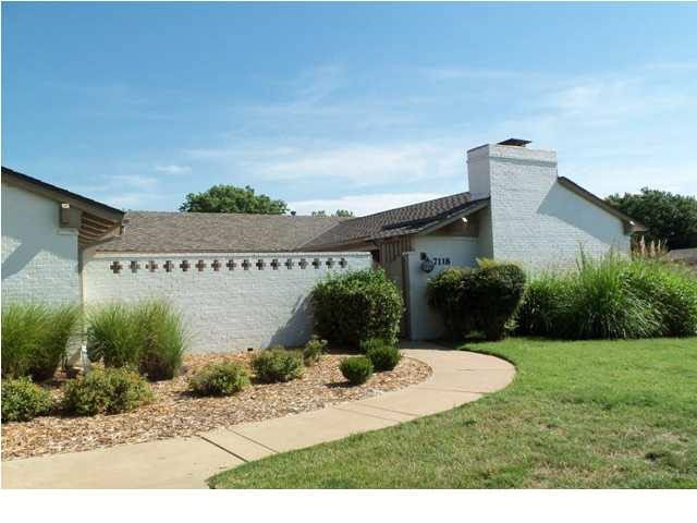 Front elevation 7118 E Douglas showing enclosed fr
