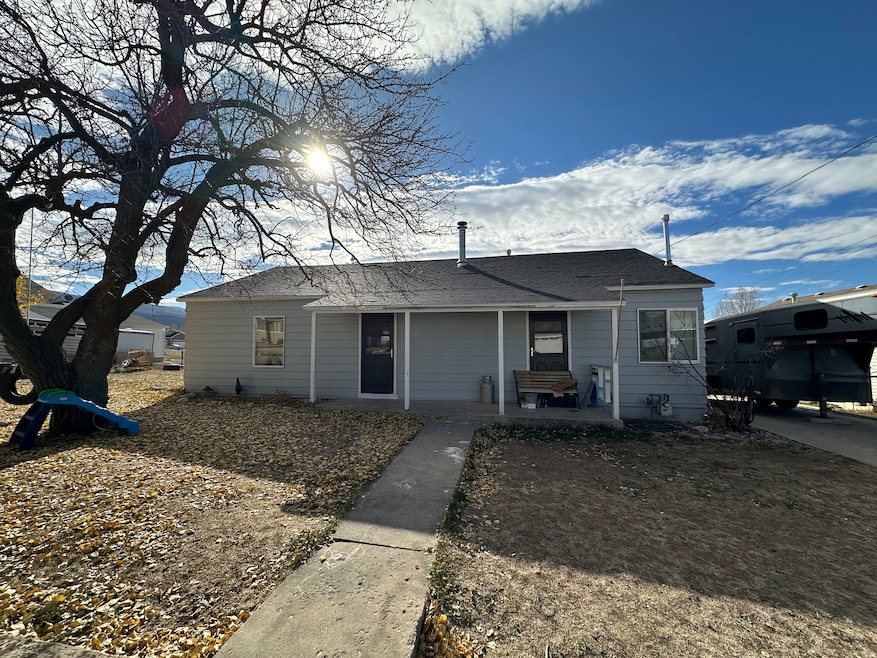 Front View of the bungalow-style home featuring a porch and roof with shingles