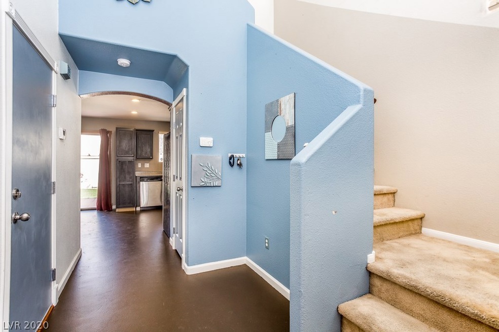 Entry way leading into the kitchen and living room