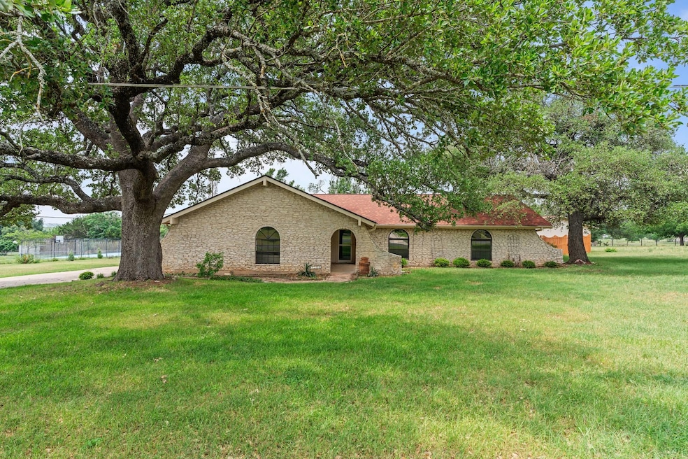 Single story home with a front lawn
