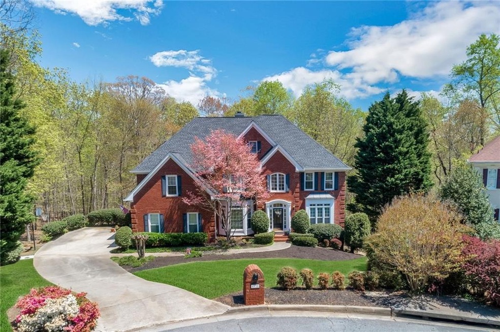 Gorgeous red brick on 3 sides sets an elegant tone