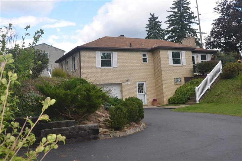 This charming home sits on a large 1+ acre lot fra