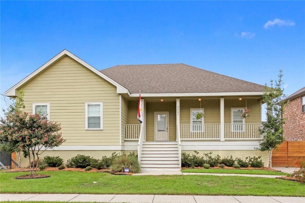 Large front porch and landscaping.