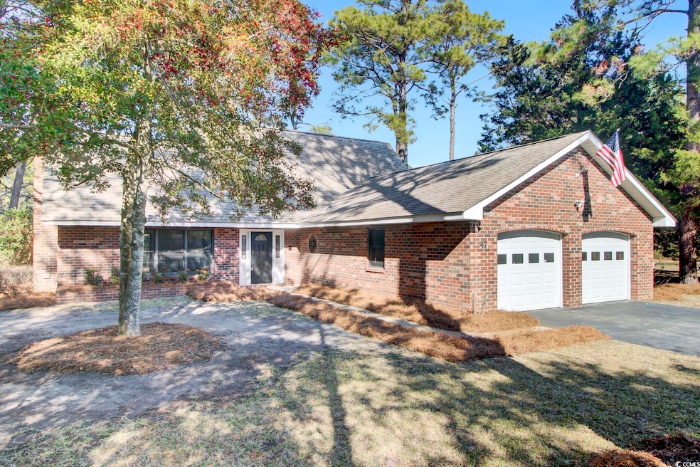 Ranch-style house featuring a garage