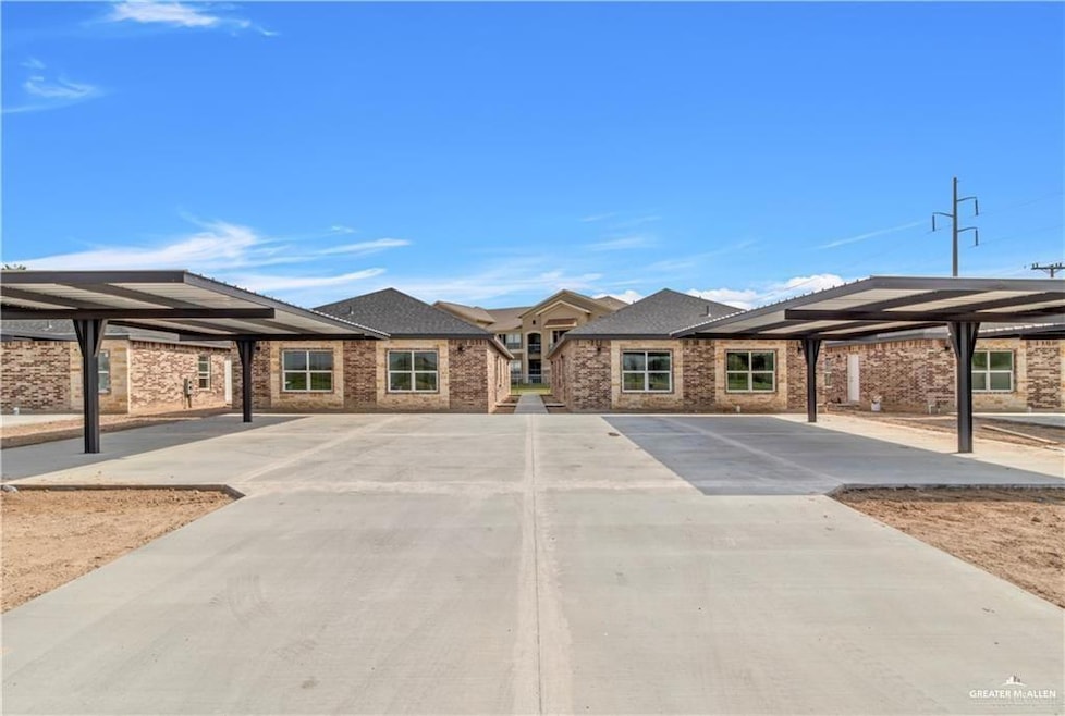 View of front of house featuring covered parking