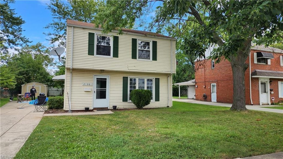 View of front of property with a storage shed and 