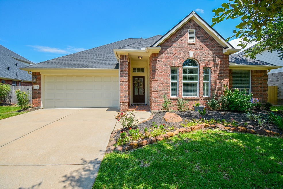 Beautiful landscaping and mature trees greet you at this 1 story custom home!