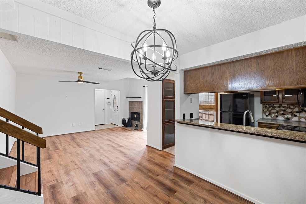 Updated light fixtures, and wood like flooring, Op