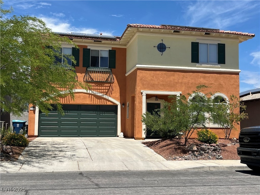Mediterranean / spanish house featuring a garage,