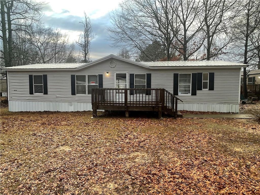 Manufactured / mobile home with a wooden deck