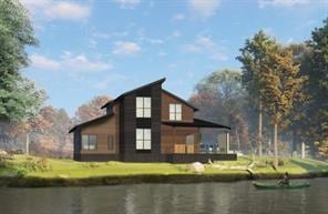 View of property exterior with a water view